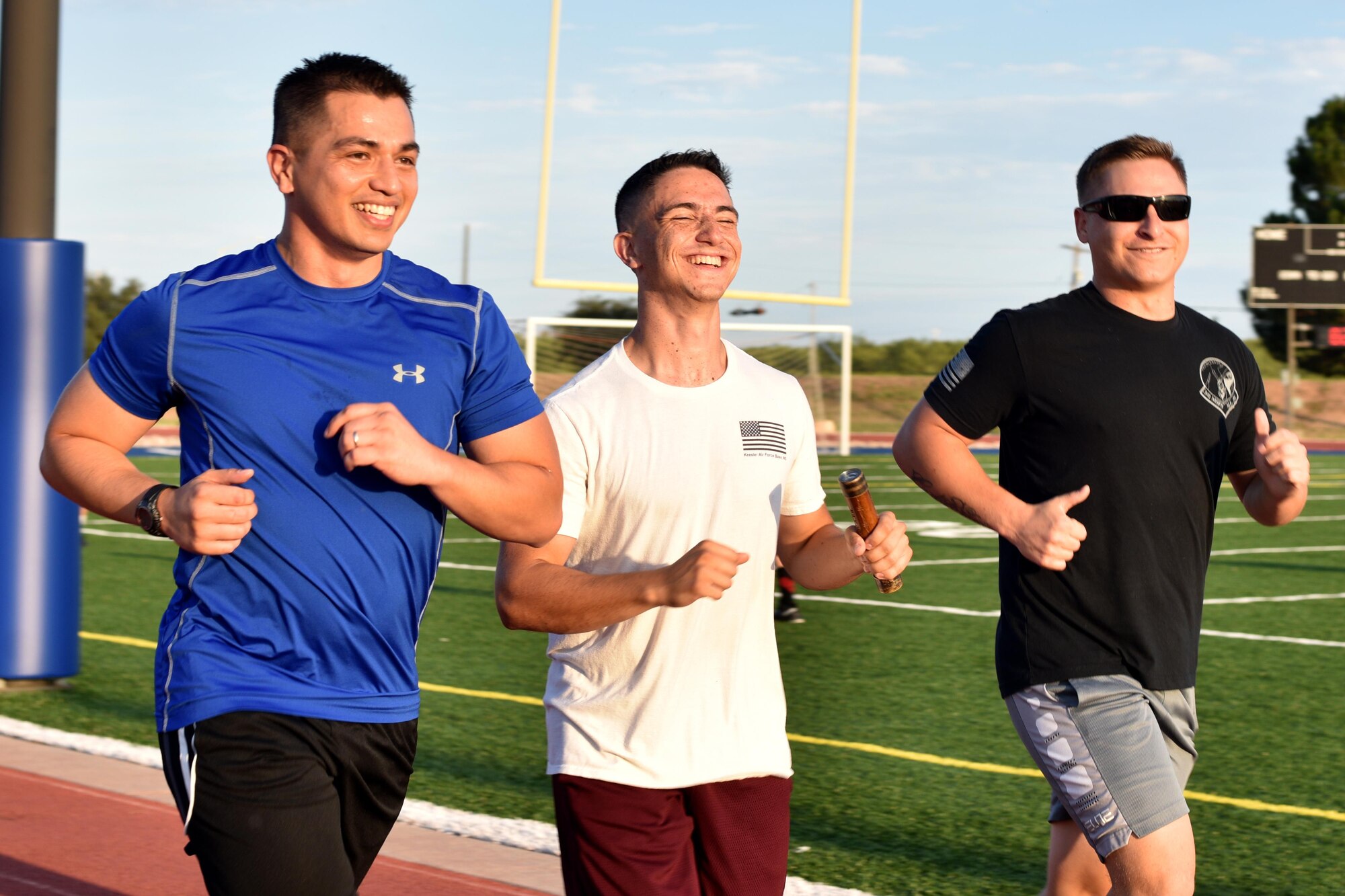 U.S. Air Force Maj. Mark Walkusky, 17th Communication Squadron commander, Airman 1st Class Nathaniel Singer, 17th CS transmissions systems operator, and Staff Sgt. Michael Janzen, 17th CS noncommissioned officer in charge, run during the Prisoners of War and Missing in Action Vigil at the track on Goodfellow Air Force Base, Texas, Sept. 8, 2017. In 1979, Congress proclaimed the first National POW/MIA Recognition Day to symbolize the steadfast resolve of the American people to never forget the men and women who gave up their freedom protecting theirs. (U.S. Air Force photo by Airman 1st Class Randall Moose/Released)