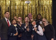 A group of attendees take a selfie at a table set up with props Sept. 8, 2017, at the Rollins Center, Dover Downs Hotel and Casino, Dover, Del. The “Wings Over Dover,” 70th Anniversary Air Force Ball was a gala-style event. (U.S. Air Force photo by Roland Balik)