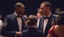 Col. Ethan Griffin, 436th Airlift Wing commander, right, speaks with Master Sgt. Harold Davis, Detachment 3, 373rd Training Squadron detachment chief during the “Wings Over Dover,” 70th Anniversary Air Force Ball Sept. 8, 2017, at the Rollins Center, Dover Downs Hotel and Casino, Dover, Del. The gala-style event provided food and entertainment for more than 800 people who attended the event. (U.S. Air Force photo by Roland Balik)