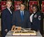 Airman Kaitlyn Kiyoko Carter, 436th Force Support Squadron force management apprentice, left, Robin Christiansen, City of Dover mayor, center, and Chief Master Sgt. Kecia Uyeno, 436th FSS superintendent, right, pose for a photo prior to cutting the “Wings Over Dover,” 70th Anniversary Air Force Ball cake Sept. 8, 2017, at the Rollins Center, Dover Downs Hotel and Casino, Dover, Del. Used by C-5A/B Galaxy aircraft, the three cut the cake using a clean and highly-polished General Electric TF-39 engine fan blade. Honoring a tradition, Carter and Uyeno represented the youngest and oldest members assigned to Dover AFB. (U.S. Air Force photo by Roland Balik)