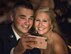 Airman 1st Class Brandon Fossett, 436th Communications Squadron cyber security technician, and his girlfriend, Becca Scott, take a selfie at their table Sept. 8, 2017, at the Rollins Center, Dover Downs Hotel and Casino, Dover, Del. The two were among the more than 800 attendees that came out for the “Wings Over Dover,” 70th Anniversary Air Force Ball, a gala-style event. (U.S. Air Force photo by Roland Balik)
