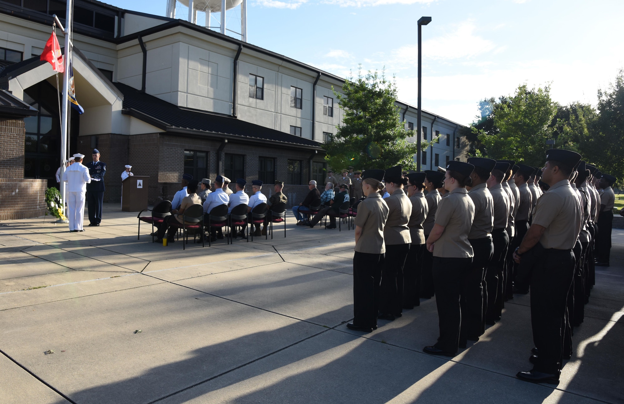 A flag folding ceremony takes place during a 9/11 memorial ceremony hosted by the Center for Naval Aviation Technical Training Unit Keesler in front of Alho Manor Sept. 11, 2017, on Keesler Air Force Base, Mississippi. The event honored those who lost their lives during the 9/11 attacks. (U.S. Air Force photo by Kemberly Groue)