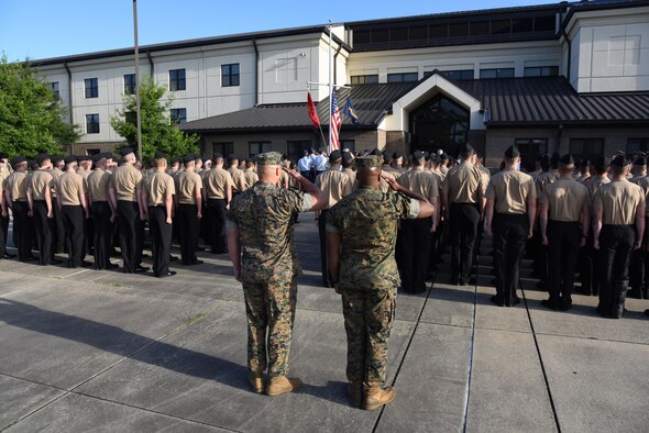 Keesler Airmen, Sailors and Marines attend a 9/11 memorial ceremony hosted by the Center for Naval Aviation Technical Training Unit Keesler in front of Alho Manor Sept. 11, 2017, on Keesler Air Force Base, Mississippi. The event honored those who lost their lives during the 9/11 attacks. (U.S. Air Force photo by Kemberly Groue)