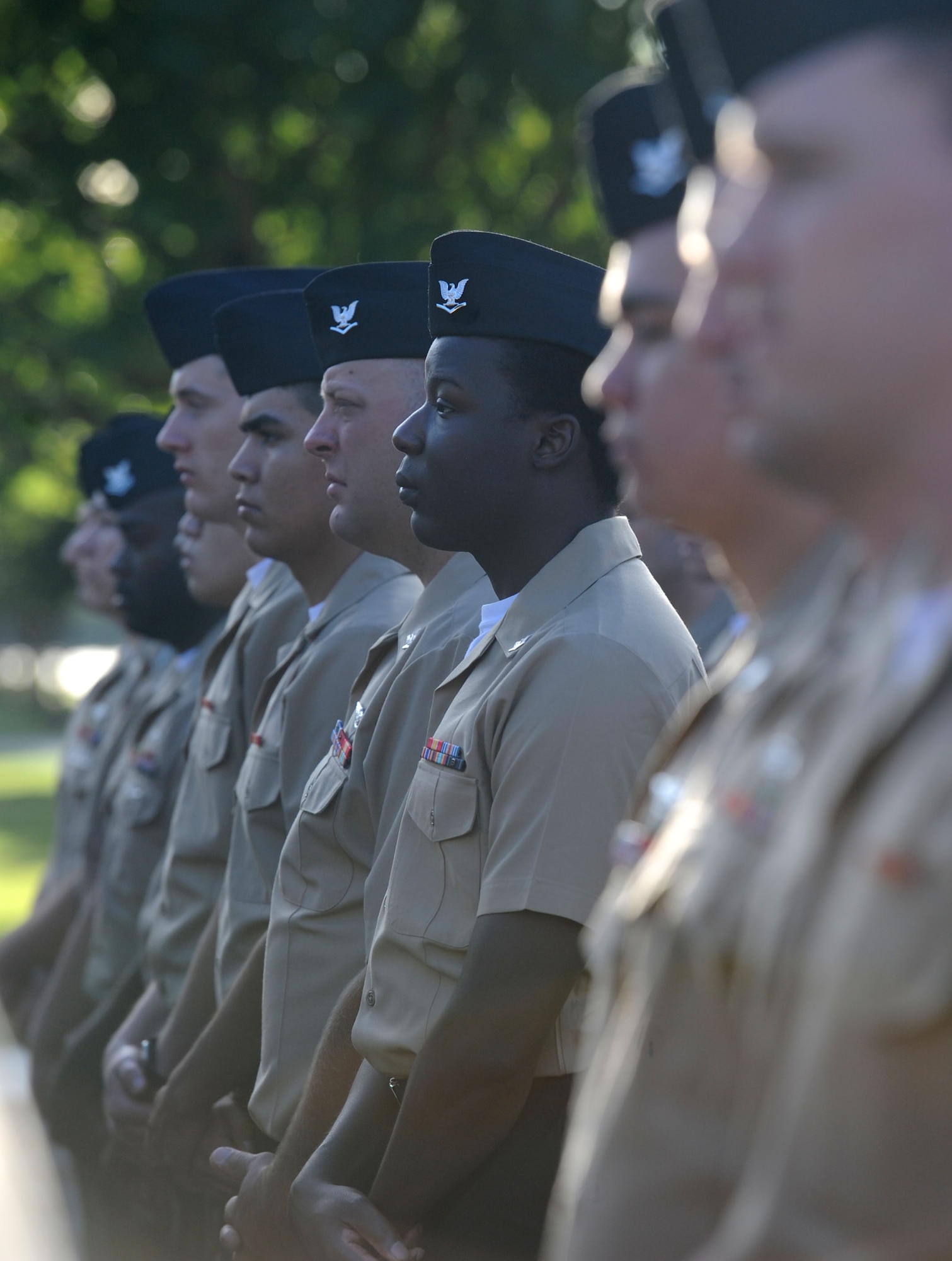 Members of the Center for Naval Aviation Technical Training Unit Keesler stand in formation during a 9/11 memorial ceremony hosted by the CNATTU Keesler in front of Alho Manor Sept. 11, 2017, on Keesler Air Force Base, Mississippi. The event honored those who lost their lives during the 9/11 attacks. (U.S. Air Force photo by Kemberly Groue)