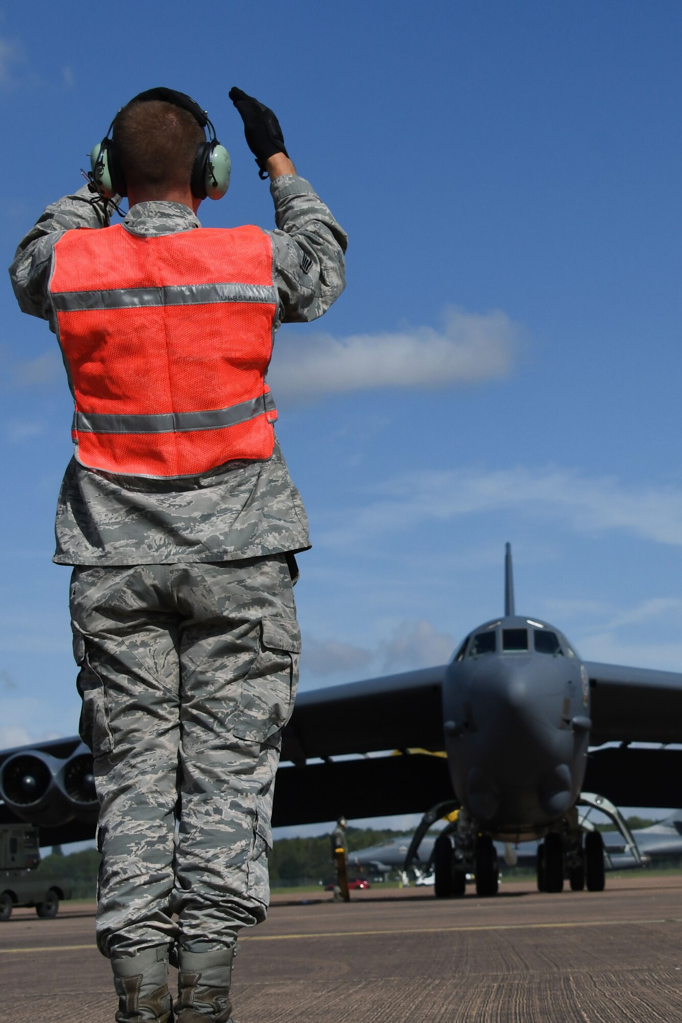 A B-52 Stratofortress is marshalled into place at Royal Air Force Fairford, U.K., Sep. 1, 2017.