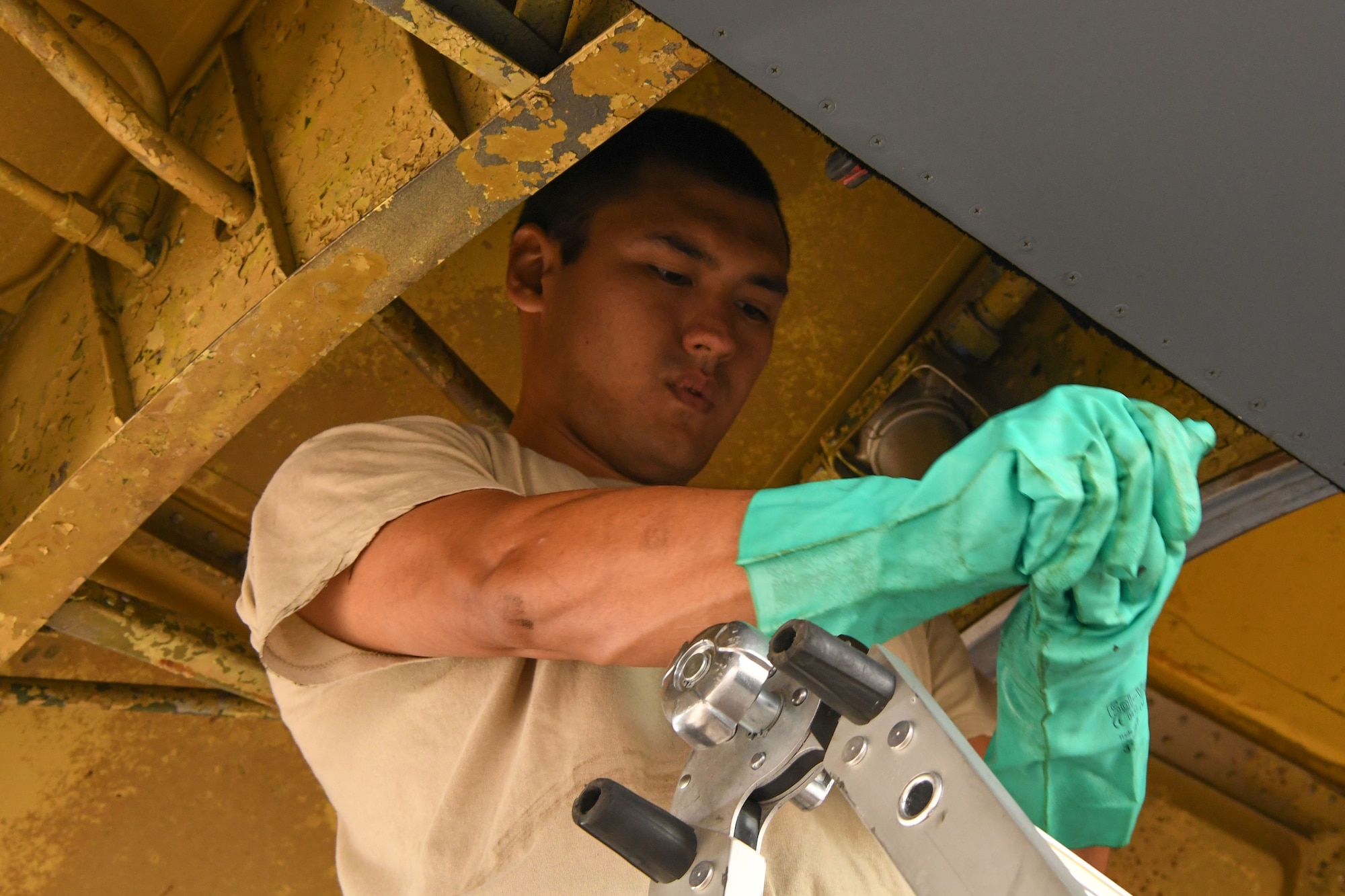 U.S. Air Force Staff Sgt. Stan Frazier, 307th Aircraft Maintenance Squadron crew chief, prepares to check hydraulic lines on a B-52 Stratofortress at Royal Air Force Fairford, U.K., Aug. 25, 2017.