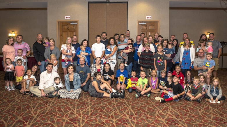 Families from the 126th Air Refueling Squadron, 182nd Airlift Wing and 183rd Wing pose for a photo during the Strong Bonds “The 7 Habits of Highly Effective Families” program in Lake Geneva, Wis., Aug. 25, 2017. The 14 Illinois Air National Guard families spent the weekend with chaplains learning how build resiliency through strengthening family relationships. (U.S. Air National Guard photo by Tech. Sgt. Lealan Buehrer)