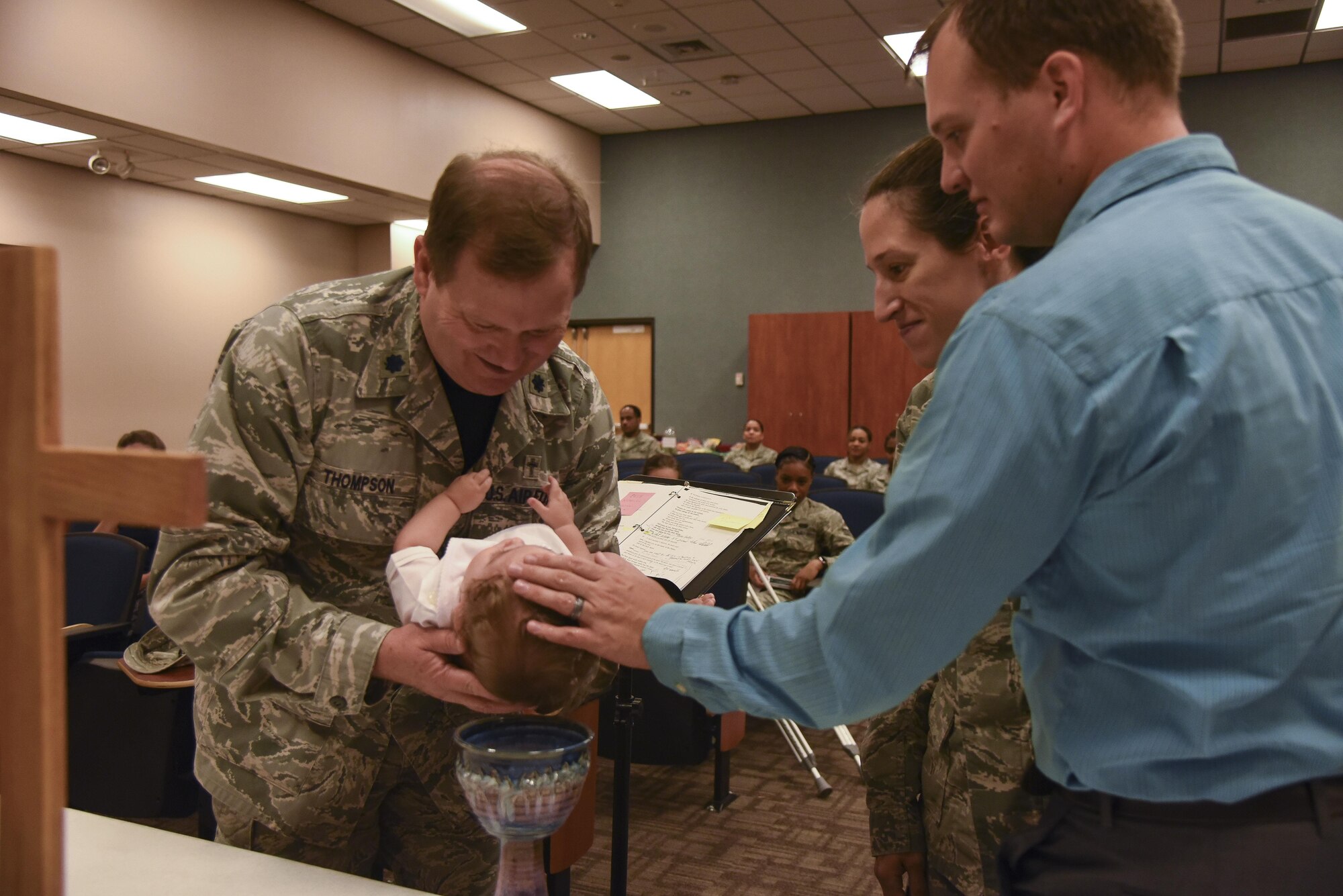 Chaplain (Lt. Col.) Pat Thompson, 403rd Wing, baptizes Caleb Benkoski, son of Capt. Brenda Gohr, 403rd Wing assistant staff judge advocate, and Maj. Aric Benkoski, 132nd Wing, Iowa Air National Guard, Sept. 10, 2017 at Keesler Air Force Base, Mississippi. “It was important to both my husband and I to have Caleb baptized just as a part of his church life and getting him exposed to that at a young age,” said Gohr. "We don’t have a home church yet back in Des Moines and I had gotten to know the Chaplain during drill weekend and doing it at the 403rd seemed like the right way.” (U.S. Air Force photo/Airman 1st Class Nathan Byrnes)