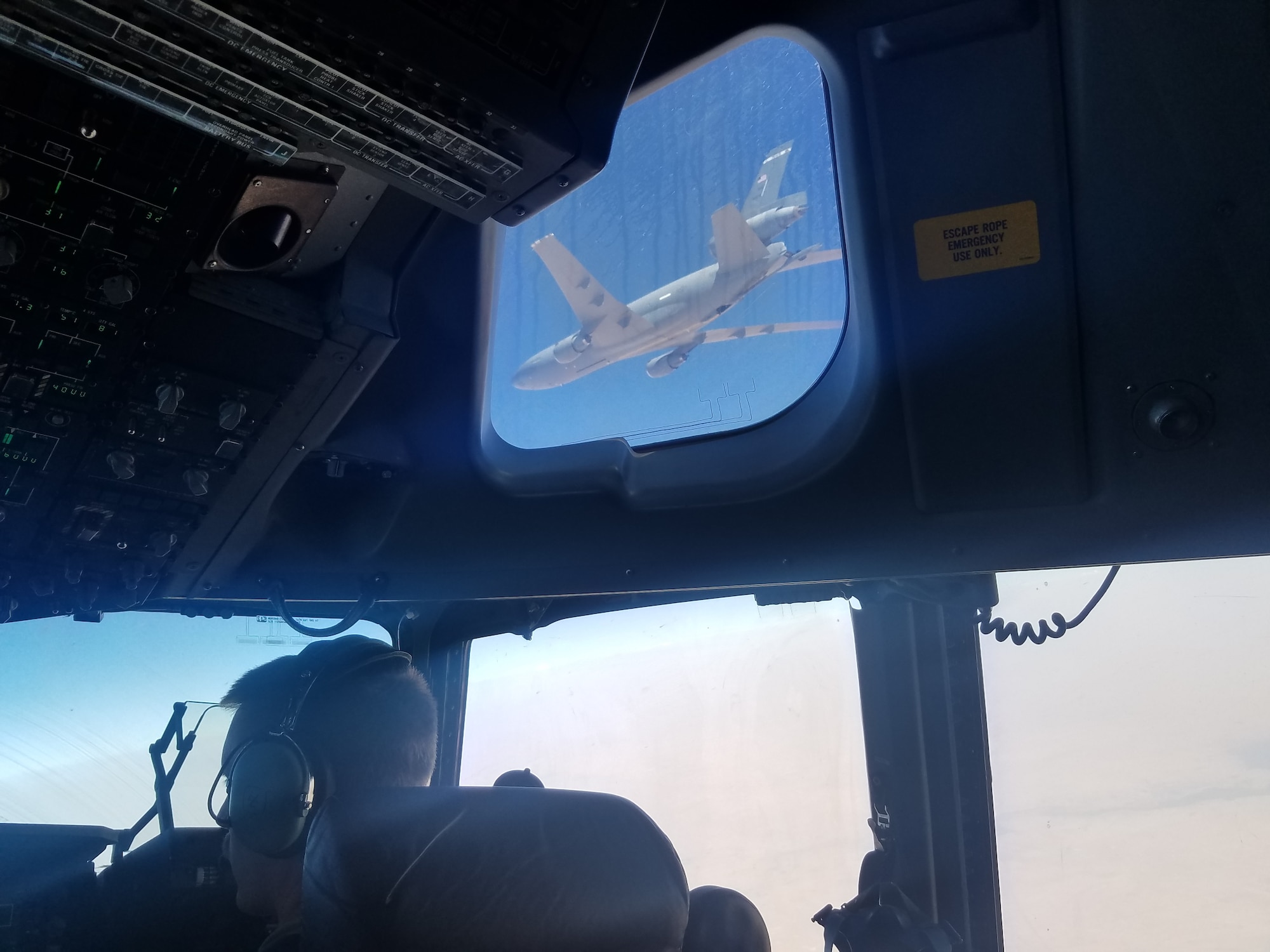 A KC-10 Extender from Travis Air Force Base, Calif., is seen from the flight deck of a C-17 Globemaster III also from Travis after an air refueling Aug. 10 over Southwest Asia. A KC-10 refueling a C-17 in a deployed environment is a rare occurrence, according to crew members of both aircraft. (Courtesy photo/Staff Sgt. Ashley Cardillo)