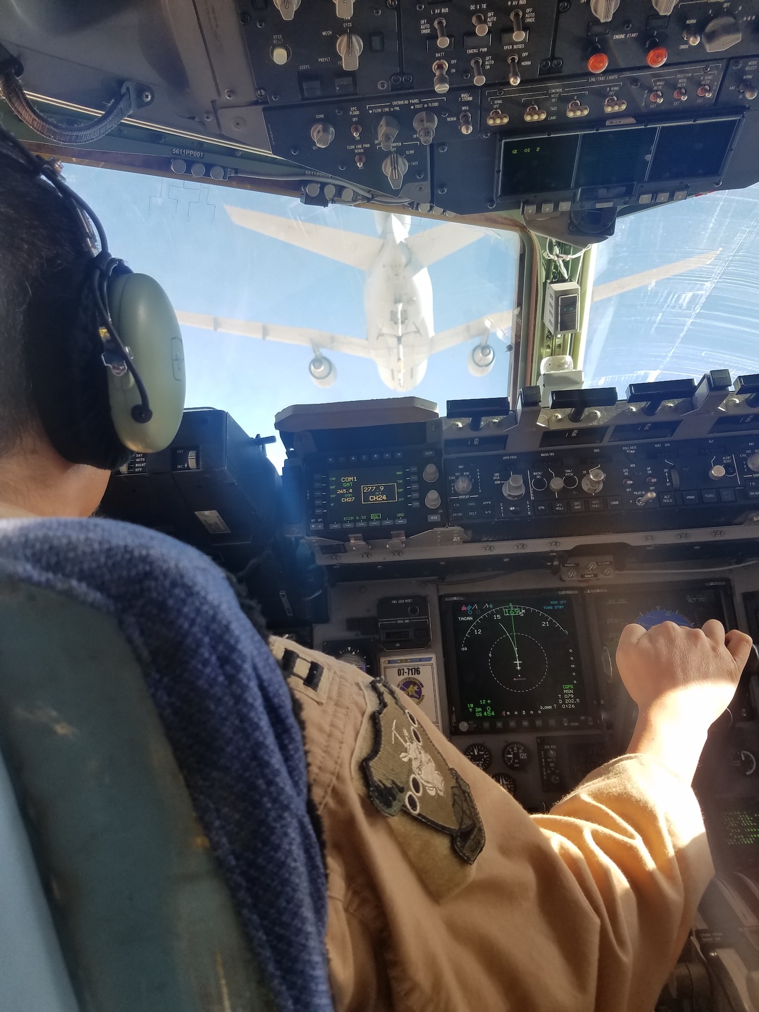 Capt. Patrick Ng, 21st Airlift Squadron pilot, maneuvers a C-17 Globemaster III into position for an air refueling with a KC-10 Extender on Aug. 10 over Southwest Asia. The planes and aircrews were both from Travis Air Force Base, Calif. (Courtesy photo/Staff Sgt. Ashley Cardillo)