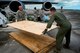 Senior Master Sgt. Tim Woods, left, and Maj. Matt O’Neil, citizen Airmen from the 434th Air Refueling Wing unload plywood at Homestead Air Reserve Base, Fla., Sept. 12, 2017. Airmen from the Hoosier Wing deployed to Homestead to assist with Hurricane Irma recovery efforts. (U.S. Air Force photo/Tech. Sgt. Benjamin Mota)