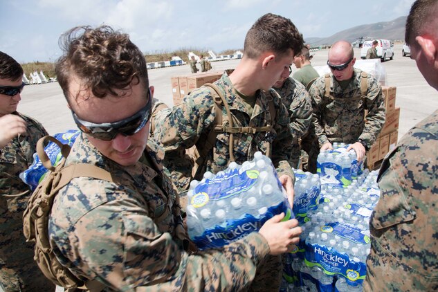 U.S. Marines with the 26th Marine Expeditionary Unit (MEU) integrated with Department of Defense services and Federal Emergency Management Agency staff, to provide aid to victims during Hurricane Irma relief efforts at St. Thomas, U.S. Virgin Islands, Sept. 12, 2017. The DOD is assisting FEMA in hurricane relief efforts by providing food, water and essential needs to the U.S. Virgin Islands.