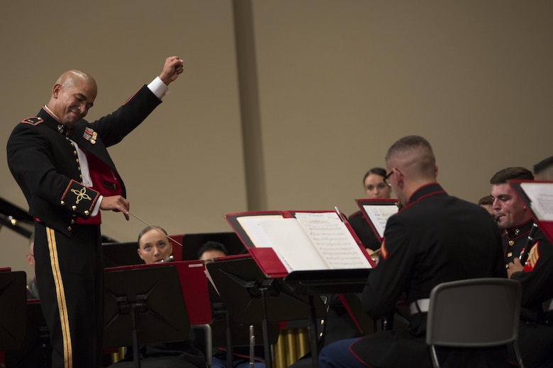 Chief Warrant Officer Andres Navarro conducts the III Marine Expeditionary Force Band during the 22nd Annual Combined Band Concert Sept. 9 at the Ginowan Civic Hall in Ginowan City, Okinawa, Japan.