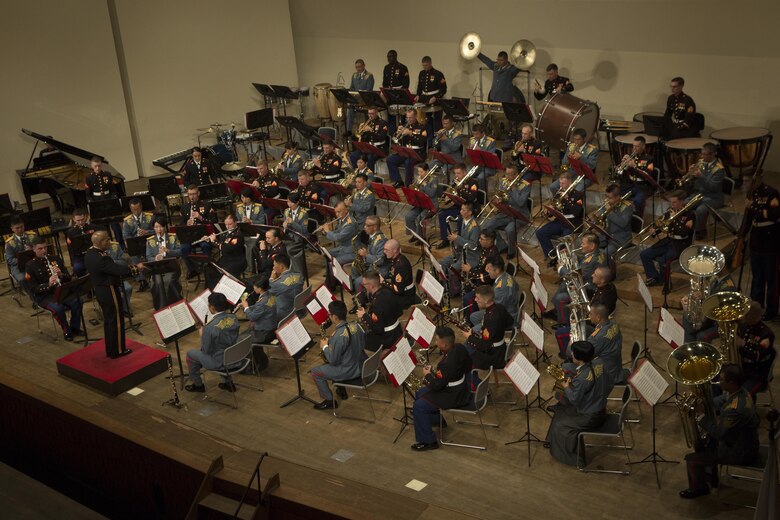 The III Marine Expeditionary Force Band and the Japan Ground Self-Defense Force 15th Brigade Band perform together during the 22nd Annual Combined Band Concert Sept. 9 at the Ginowan Civic Hall in Ginowan City, Okinawa, Japan.