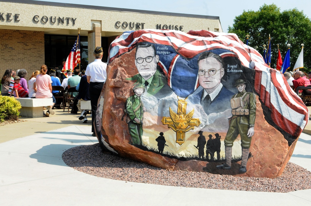 This rock was painted and dedicated at Cherokee, Iowa during a ceremony that was part of the Freedom Rock Tour, September 10, 2017. The rock honors the service members past and present from Cherokee County, Iowa, and was painted by Ray "Bubba" Sorensen II as a tribute. This rock is part of a collective effort to place a Freedom Rock in each of Iowa's 99 counties. During the ceremony, Cherokee County native, and Commanding General of the 88th Regional Support Command, Maj. Gen. Patrick Reinert spoke about his service and the honor he has of being a veteran from Cherokee County.