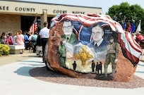 This rock was painted and dedicated at Cherokee, Iowa during a ceremony that was part of the Freedom Rock Tour, September 10, 2017. The rock honors the service members past and present from Cherokee County, Iowa, and was painted by Ray "Bubba" Sorensen II as a tribute. This rock is part of a collective effort to place a Freedom Rock in each of Iowa's 99 counties. During the ceremony, Cherokee County native, and Commanding General of the 88th Regional Support Command, Maj. Gen. Patrick Reinert spoke about his service and the honor he has of being a veteran from Cherokee County.