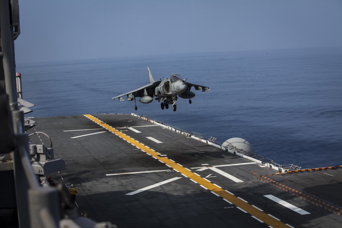 A U.S. Marine Corps AV-8B Harrier aircraft belonging to Marine Attack Squadron (VMA) 311 prepares to land aboard the amphibious assault ship USS Bonhomme Richard (LHD 6) while underway in the Pacific Ocean, June 9, 2017.