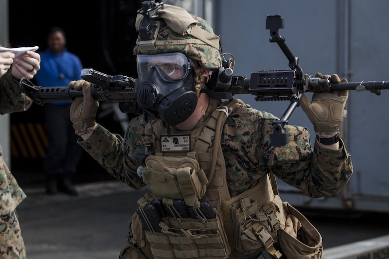 Lance Cpl. Benjamin Cartwright, an unmanned aerial system controller with Kilo Company, Battalion Landing Team, 3rd Battalion, 5th Marines, 31st Marine Expeditionary Unit, conducts an exercise during combat conditioning marksmanship training aboard the USS Bonhomme Richard (LHD 6) while underway in the Pacific Ocean, June 24, 2017.