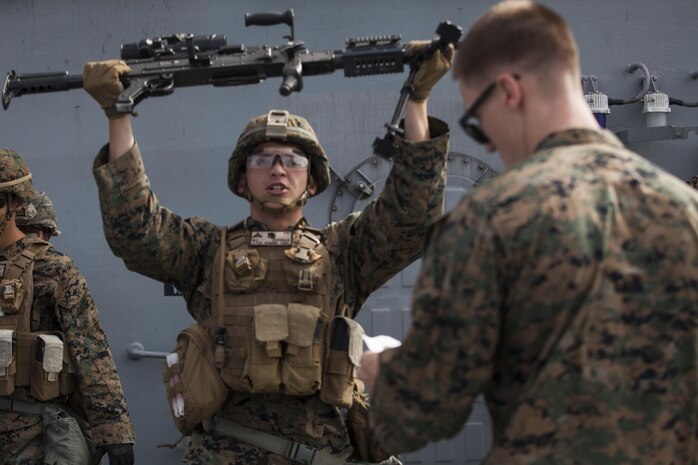 Lance Cpl. Joshua Lecleir, a rifleman with Kilo Company, Battalion Landing Team, 3rd Battalion, 5th Marines, 31st Marine Expeditionary Unit, conducts an exercise during combat conditioning marksmanship training aboard the USS Bonhomme Richard (LHD 6) while underway in the Pacific Ocean, June 24, 2017.