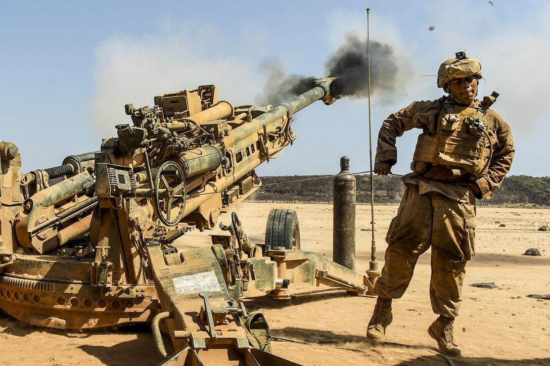 A Marine fires a howitzer during training.