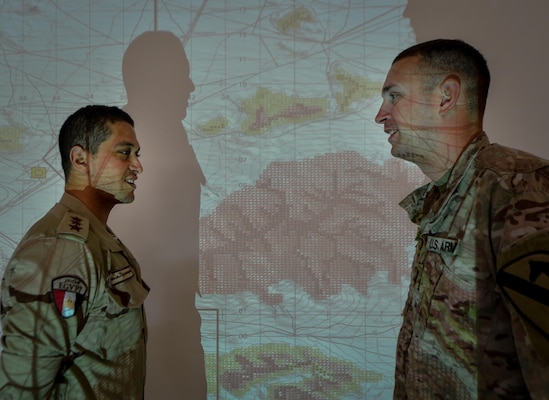 U.S. Army 1st Daniel Bernhard, 2-7 U.S. Cavalry, 3rd Armored Brigade Combat Team, 1st Cavalry Division assistant operations officer, speaks with an Egyptian solider during a command-post exercise portion of Bright Star 2017, Sept. 10, 2017, at Mohamed Naguib Military Base, Egypt. More than 200 U.S. service members are participating alongside the Egyptian armed forces for the bilateral U.S. Central Command Exercise Bright Star 2017, Sept. 10 – 20, 2017 at Mohamed Naguib Military Base, Egypt. (U.S. Air Force photo by Staff Sgt. Michael Battles)