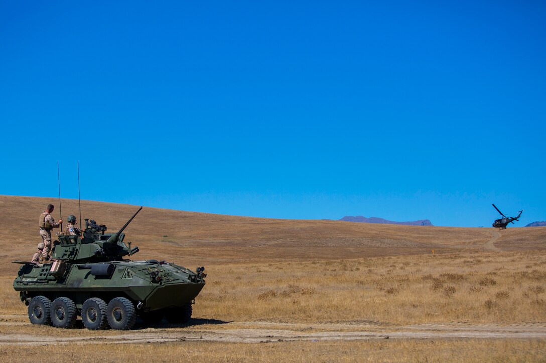 Marines with Marine Forces Reserve observe Georgian helicopter performing special operations insertions as they prepare for a mechanized assault portion of a combined-arms exercise during Exercise Agile Spirit Orpholo, Georgia, Sept. 8, 2017. Exercise Agile Spirit is a multilateral training exercise designed to promote unit cohesion and interoperability between the United States, Georgian, and other NATO and partner nations. (U.S. Marine Corps Photo by SSgt Marcin Platek/Released)