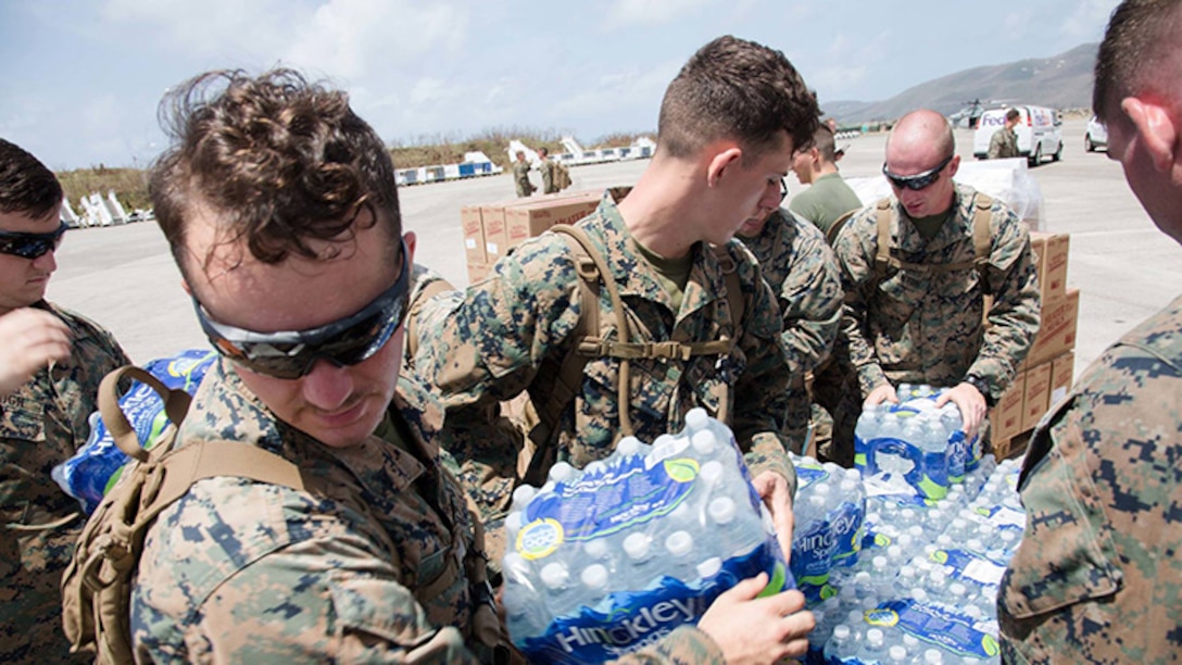 U.S. Marines with the 26th Marine Expeditionary Unit, unload emergency care items at the St. Thomas Cyril E. King Airport, U.S. Virgin Islands, Sept. 12, 2017.