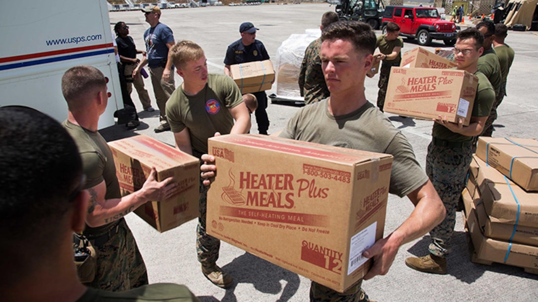 U.S. Marines with the 26th Marine Expeditionary Unit, unload emergency care items at the St. Thomas Cyril E. King Airport, U.S. Virgin Islands, Sept. 12, 2017.