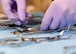 Senior Airman Alexis Lopez, dental assistant with the 319th Medical Group, lays out an array of dental instruments used in routine check-ups and procedures Sept. 7, 2017, at the medical treatment facility on Grand Forks Air Force Base, N.D. One of the first things dental assistants learn during their training is the proper names and uses of the instruments.