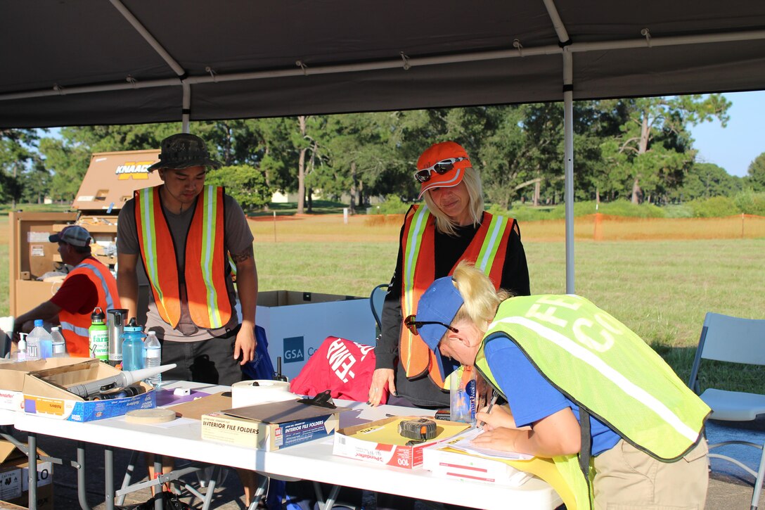 Pictured are DDXX team members assisting with the required paperwork at the Incident Support Base at Maxwell Air Force Base, Alabama.