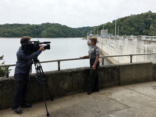 Paul Mojonnier, Tennessee Crossroads videographer, interviews Park Ranger Sondra Carmen Sept. 11, 2017 at Dale Hollow Dam in Celina, Tenn., for an upcoming episode in early 2018 for a feature as part of the dam’s 75th anniversary, also in 2018. The program airs on Nashville Public Television. (USACE photo by Steve Crawford)