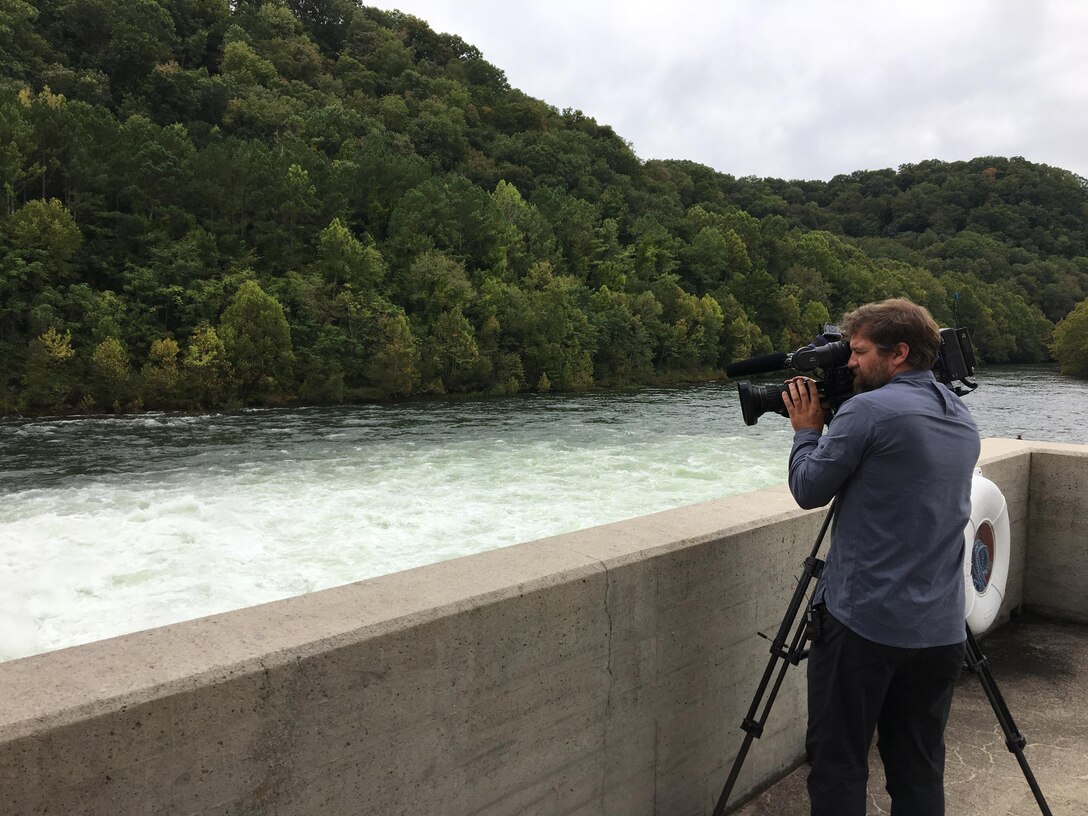 Paul Mojonnier, Tennessee Crossroads videographer, shoots footage Sept. 11, 2017 of Dale Hollow Dam’s tailwater in Celina, Tenn., for an upcoming episode in early 2018 for a feature as part of the dam’s 75th anniversary, also in 2018. The program airs on Nashville Public Television. (USACE photo by Sondra Carmen)
