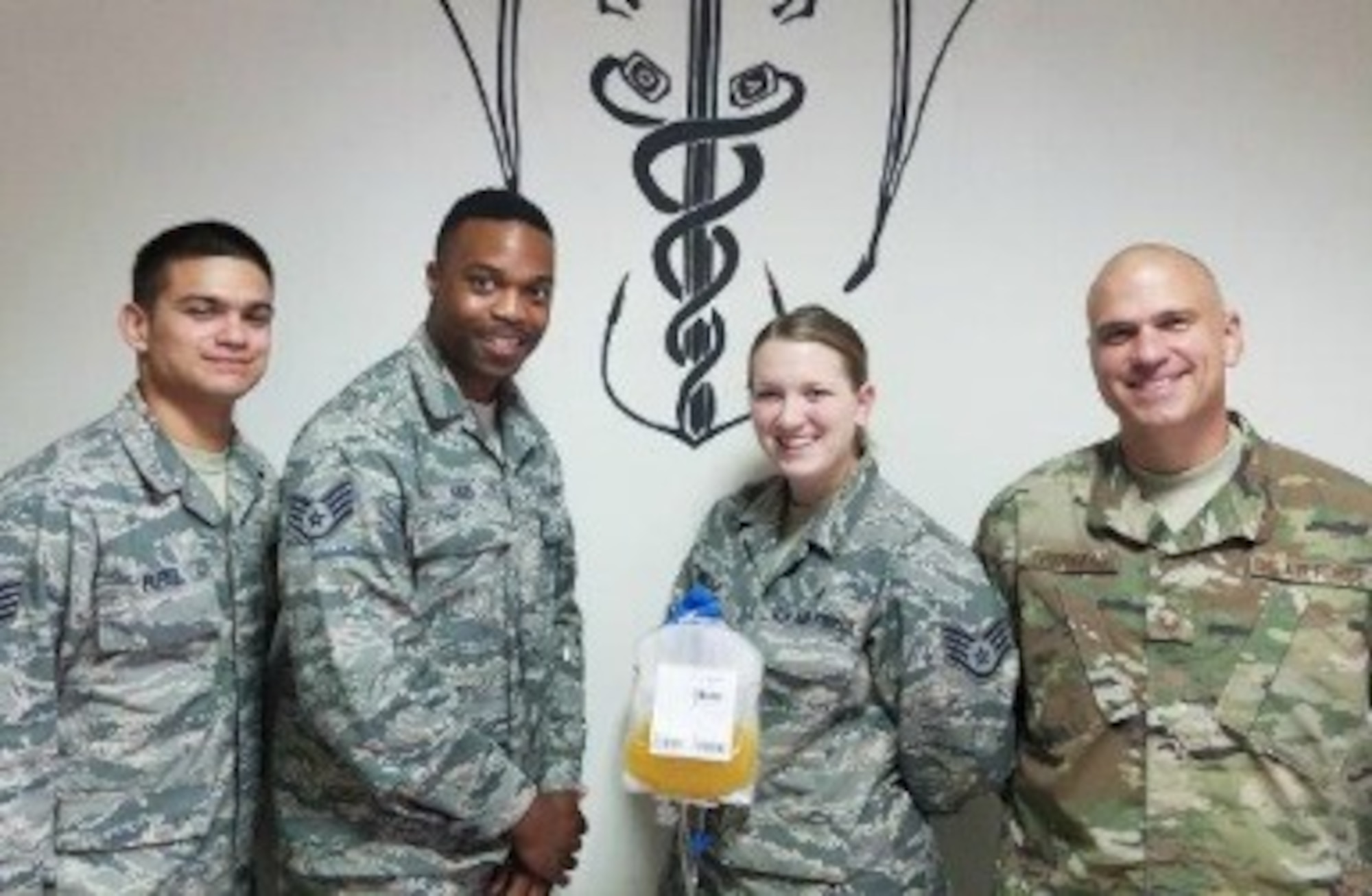 The apheresis team collected the first cold storage platelet unit in Southwest Asia, Aug. 16, 2017. Air Force Senior Master Sgt. Scott Thibodeau (right) was the first donor. (Courtesy photo)