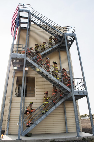 Firefighters with the 5th Civil Engineer Squadron hosted a 9/11 memorial climb in honor of those who lost their lives on 9/11. The firefighters climbed 110 flights of stairs representing each floor of the twin towers.