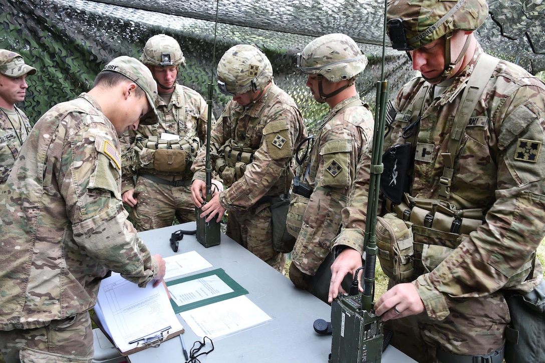Soldiers put radios into operation during the Expert Infantryman Badge competition.