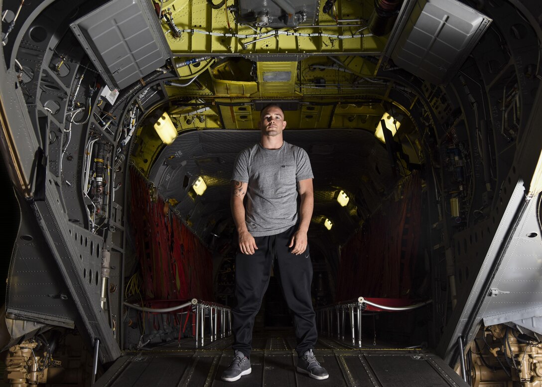 Colby Covington, Ultimate Fighting Championship welterweight division fighter, poses for a photo in the back of a CH-47 Chinook trainer at Joint Base Langley-Eustis, Va., Sep. 7, 2017.