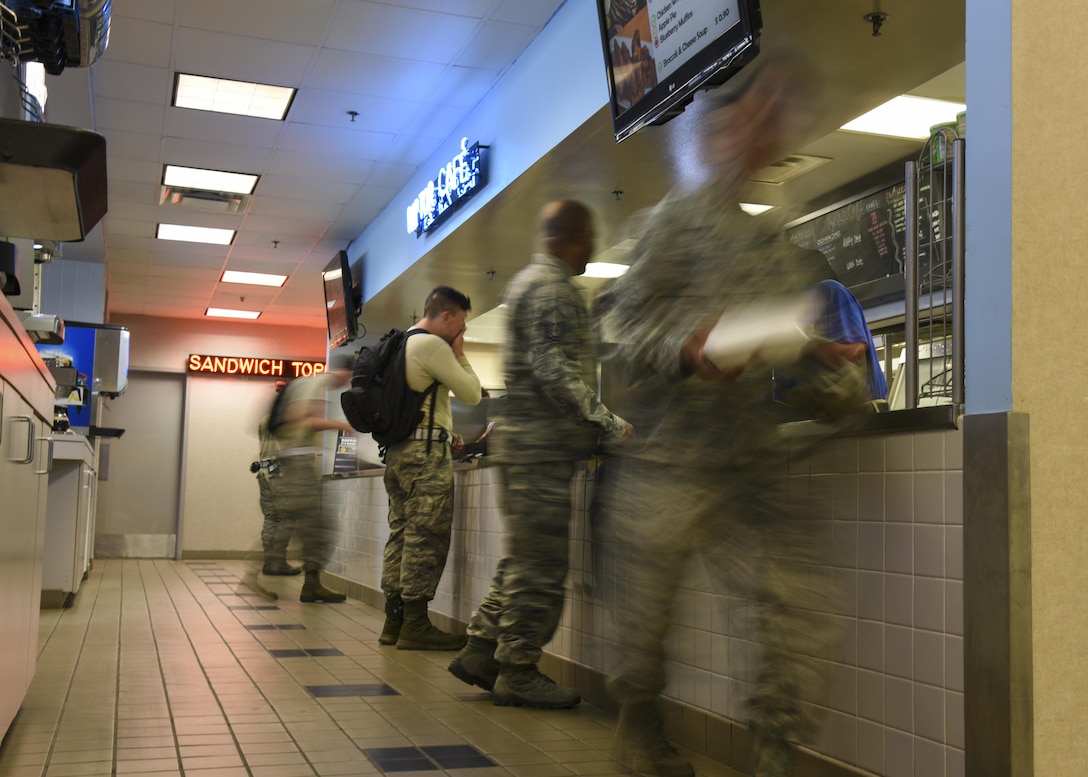 U.S. Air Force 1st Maintenance Squadron Airmen pick up their lunch at the Raptor Café at Joint Base Langley-Eustis, Va., Sept. 9, 2017.