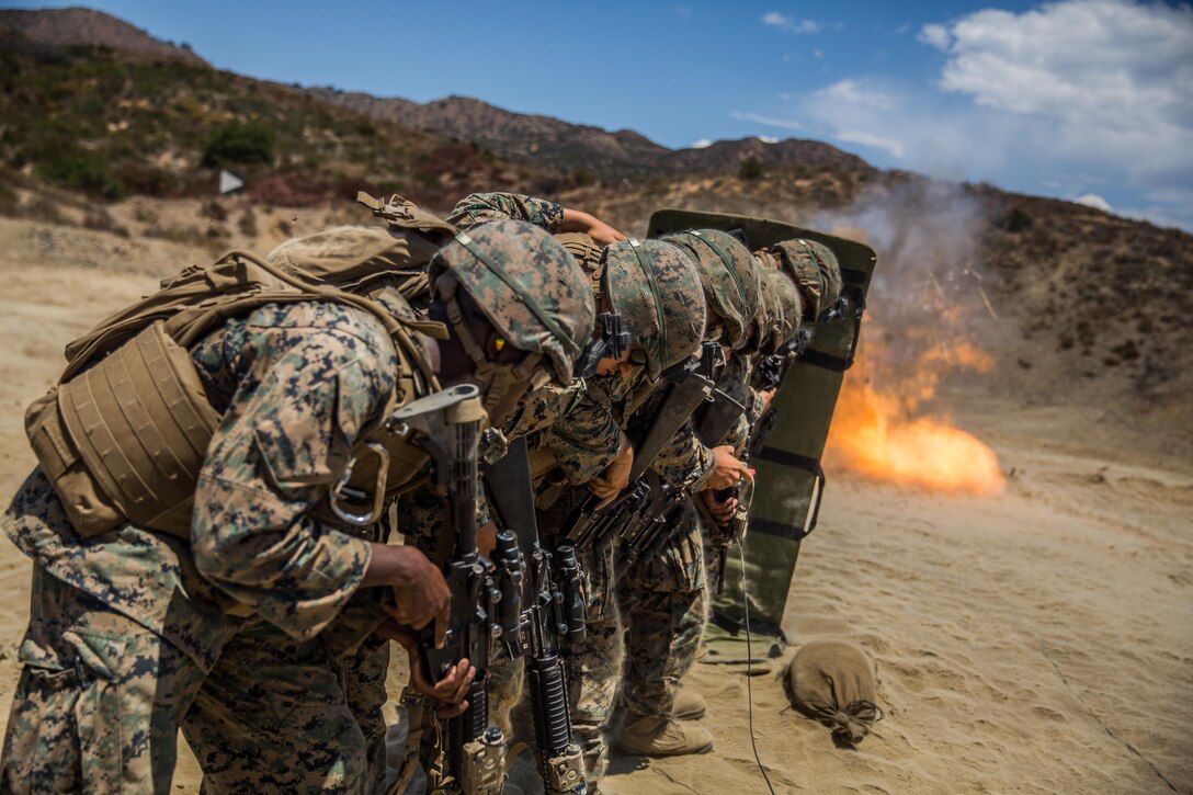 Marines with Combat Service Support Company, I Marine Expeditionary Force Information Group, line up behind a ballistic blanket before performing a simulated door breach at Camp Pendleton, Calif., Aug. 1, 2017. The Marines conducted the training to further develop their combat capabilities as part of the stand-up of the Marine Support Battalion. The mission of the new unit is to provide extensive logistical support to I MEF and I Marine Expeditionary Brigade command element, both in garrison and on deployment.