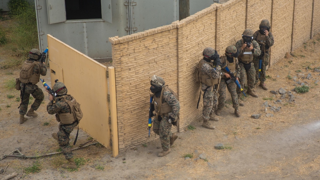 Marines with Combat Service Support Company, I Marine Expeditionary Force Information Group, conduct room clearing operations in a military operations in urban terrain town at Camp Pendleton, Calif., Aug. 1, 2017. The Marines conducted the training to further develop their combat capabilities as part of the stand-up of the Marine Support Battalion. The mission of the new unit is to provide extensive logistical support to I MEF and I Marine Expeditionary Brigade command element, both in garrison and on deployment.