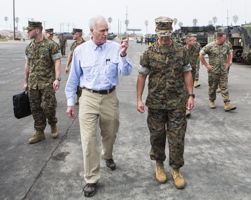 Secretary of the Navy Richard V. Spencer, left, walks with Lt. Gen. Lewis Craparotta, right, commanding general of 1st Marine Expeditionary Force during his visit to 3rd Assault Amphibian Battalion at Marine Corps Base Camp Pendleton, Calif., August 30, 2017. Spencer also toured other I MEF units and met with I MEF leadership during his visit. (U.S Marine Corps photo by Lance Cpl. Justin E. Bowles)