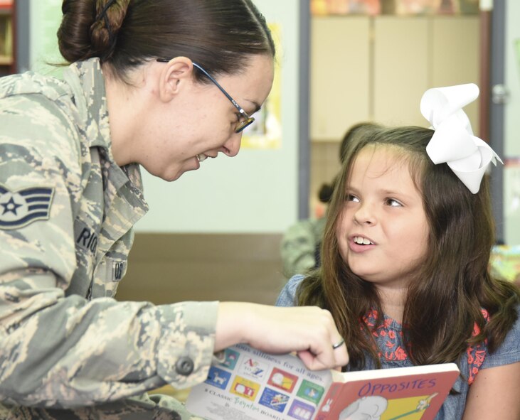 Staff Sgt. Kirsten Rios, 301st Medical Squadron, reads to a special needs student Aug. 23, 2017, at Lone Star Elementary School in Keller, Texas. Eight Reserve medical Airmen visited the school to connect and read to students as part their unit's community outreach program. (U.S. Air Force photo by Ms. Julie Briden-Garcia)
