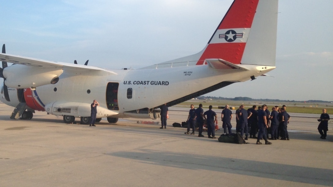 Coast Guard crews from the western Lake Michigan region prepare to depart Mitchell Airport in Milwaukee in support of operations related to Hurricane Harvey, Aug. 29, 2017. Twenty-six members from Coast Guard Stations Sturgeon Bay, Sheboygan, Milwaukee, and Kenosha in Wisconsin, and Station Wilmette Harbor, Illinois deployed with seven inflatable swiftwater rescue boats, and will be involved in search and rescue missions. U.S. Coast Guard photo