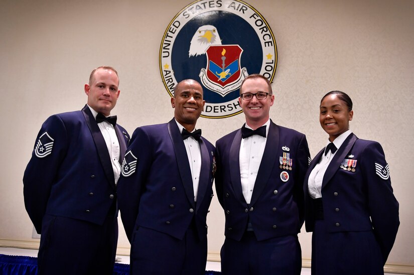 From left to right, Master Sgt. Darryl Lane, 628th Medical Group Unit Training Manager, Master Sgt. Christopher Hughes, 628th Force Support Squadron Airman Leadership School commandant, Tech. Sgt. Jordan Fiebelkorn, 628th FSS ALS instructor, and Tech. Sgt. Kaneisha Lipscomb, 628th FSSALS instructor stand together during an ALS graduation ceremony here, Aug. 31, 2017.