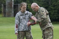 Medical Detachment Soldiers apply moulage