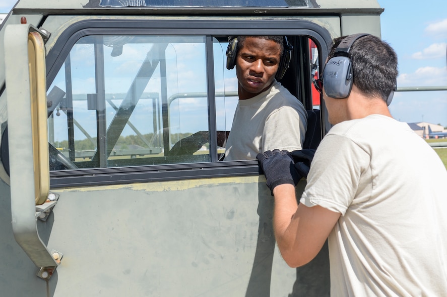 375th Logistics Readiness Squadron “Port Dawgs” members discuss off-loading actions for cargo on a C-5 Galaxy aircraft at Scott Air Force Base, Ill., Sept. 9, 2017.