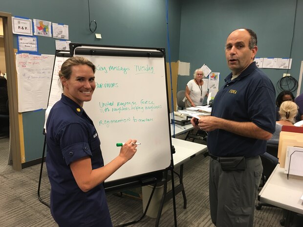 Coast Guard Lt. Commander Karen Kutkiewicz and Federal
Emergency Management Agency reservist Matt Proietti work on a writing plan Sept. 6, 2017, at the Hurricane Harvey Joint Field Office in Austin, Texas. Proietti, a Penn Valley, California, resident, is superintendent of 4th Combat Camera Squadron, Joint Base Charleston, South Carolina. Kutkiewicz is a public affairs officer at the Coast Guard's 1st District Headquarters in Boston. Both are graduates of the military's Defense Information School. (courtesy photo)