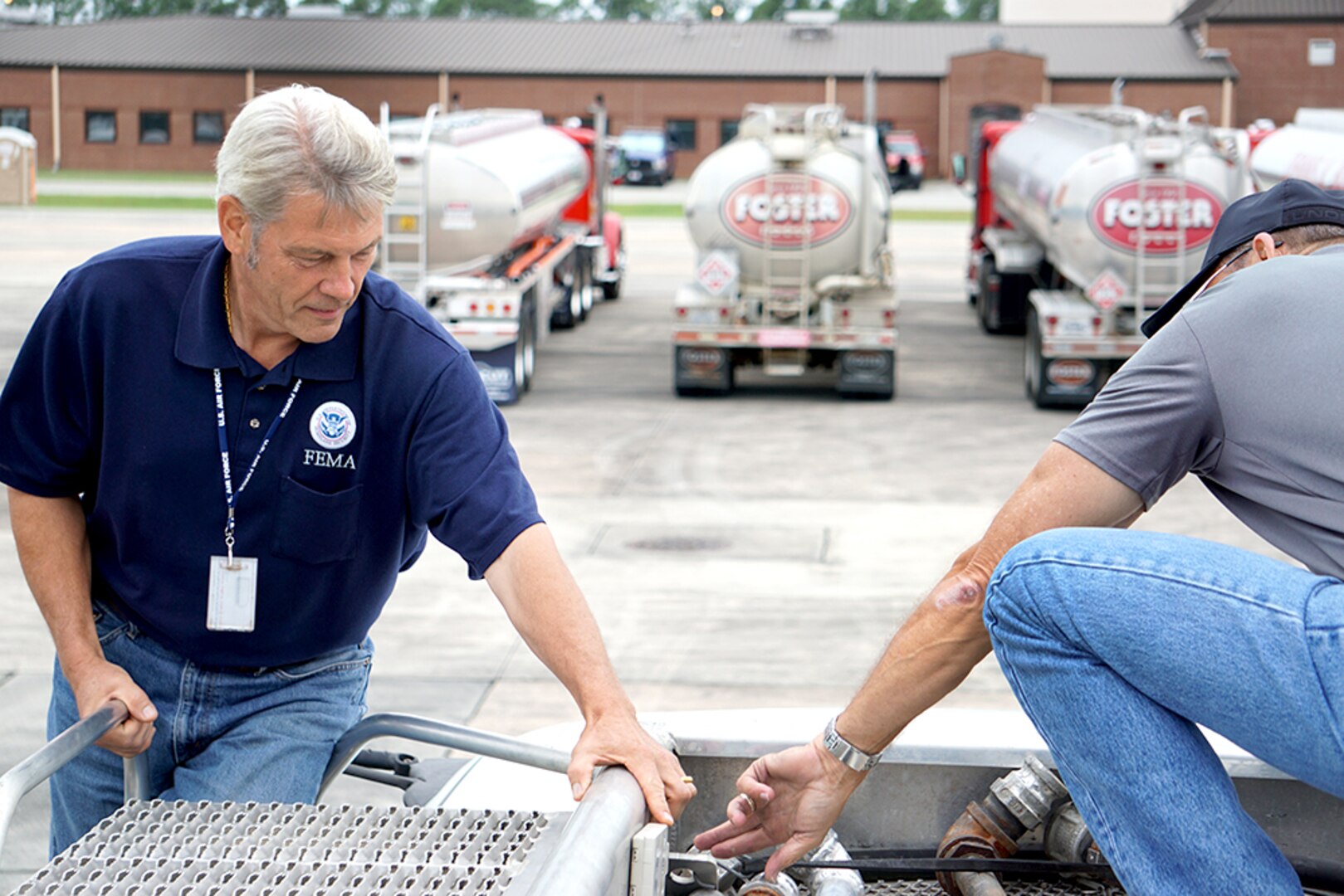 Robins Air Force Base was teeming with activity as Hurricane Irma approached Florida last week. At the FEMA Fuel Staging Area on base, Christopher Dresel FEMA representative, left, and Bryan Hill, Task Force Americas quality assistance representative, conducts an inspection of the FEMA transponder to ensure the device is placed in the proper location. (U.S. Air Force photo/ED ASPERA)