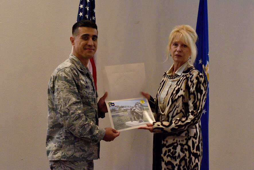 .S. Air Force Col. Ricky Mills, 17th Training Wing commander, presents an Honorary Commander certificate to Brenda Gunter, San Angelo mayor, at the Event Center on Goodfellow Air Force Base, Texas, Sept. 11, 2017. Mills selected Gunter as an Honorary Commander for her contributions to the base and community relations. (U.S. Air Force photo by Airman 1st Class Randall Moose/Released)