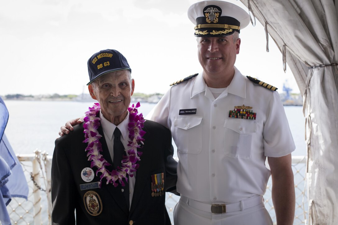 Former U.S. Navy Petty Officer 1st Class Art Albert and Capt. Timothy Halladay stand side by side after the 72nd Anniversary of the End of World War II ceremony aboard the USS Battleship Missouri Memorial, Pearl Harbor, Hawaii, September 2, 2017. The ceremony on the aft deck was attended by dignitaries from the United States and other nations. Today, the U.S. and Japan stand together, showcasing an alliance of peace forged between our two nations. (U.S. Marine Corps photo by Cpl. Maximiliano Rosas)