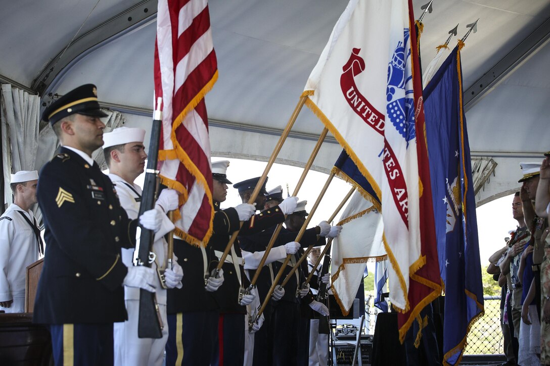 The U.S. Pacific Command Joint Service Color Guard presents the colors during the 72nd Anniversary of the End of World War II ceremony aboard the USS Battleship Missouri Memorial, Pearl Harbor, Hawaii, Sep. 2, 2017. The ceremony on the aft deck was attended by dignitaries from the United States and other nations. Today, the U.S. and Japan stand together, showcasing an alliance of peace forged between our two nations. (U.S. Marine Corps Photo by Lance Cpl. Sandra A. Garduno)